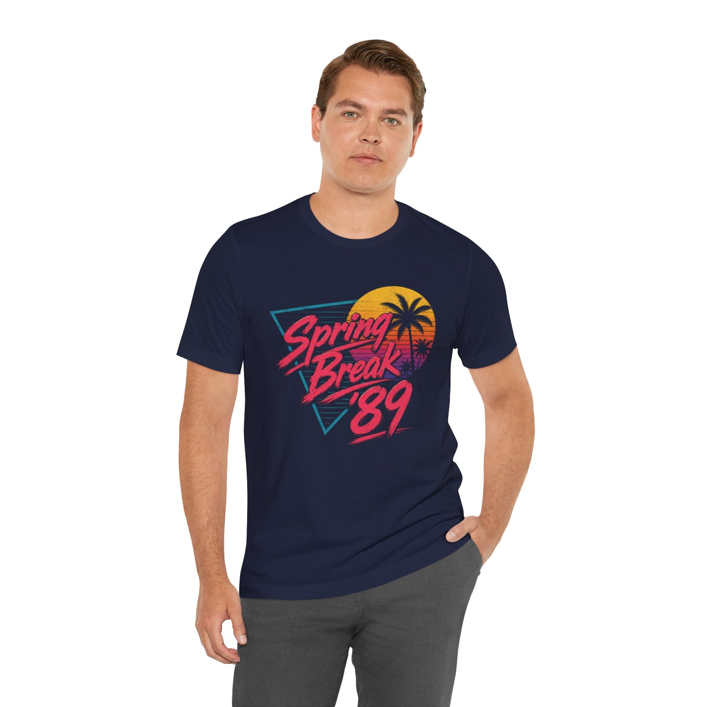 A man wearing a navy blue t-shirt with a colorful retro 'Spring Break 89' graphic on the chest.