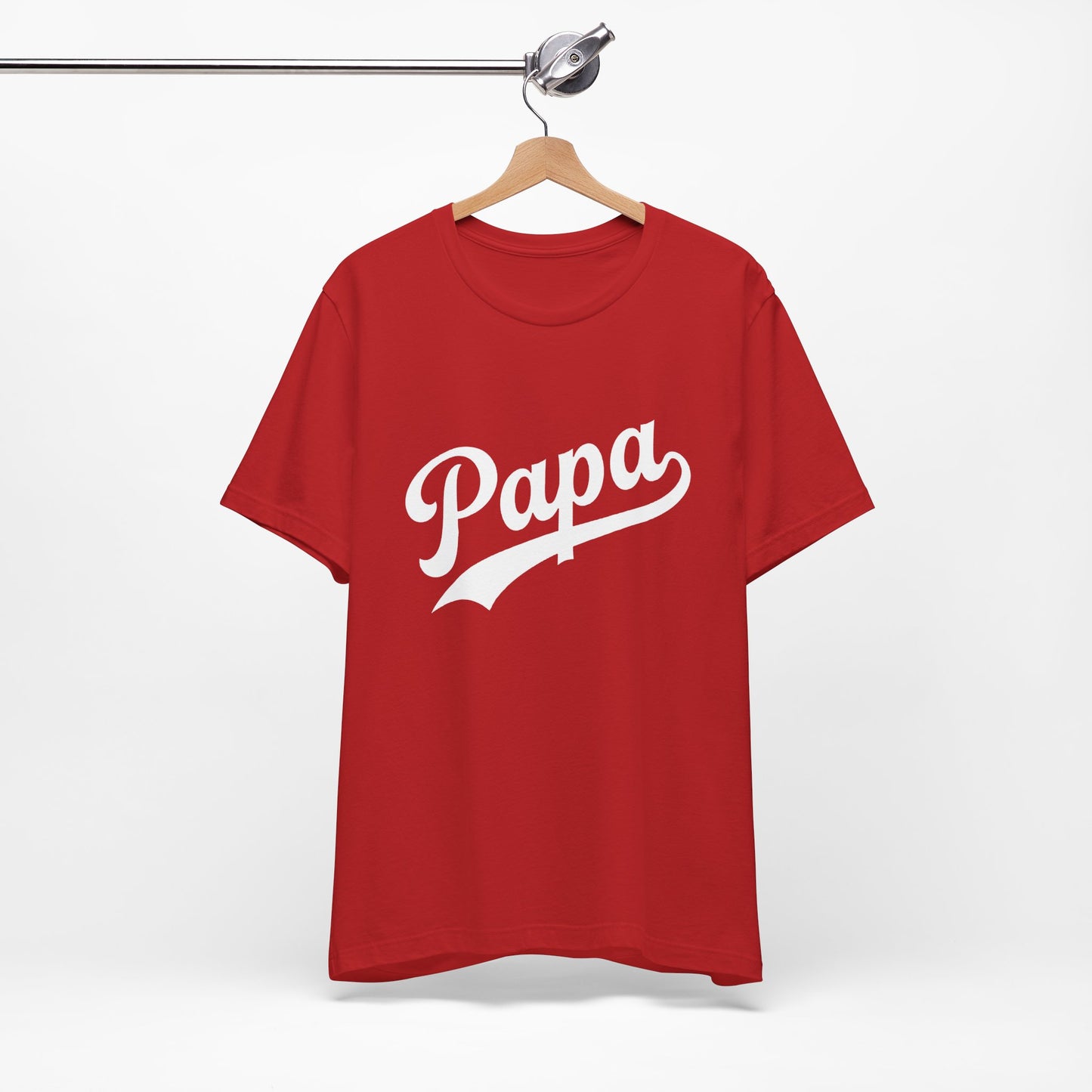 A red short-sleeve t-shirt featuring the word 'Papa' printed in a white retro script across the chest.