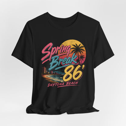 A crewneck t-shirt featuring a colorful retro graphic on the front that reads 'Spring Break 86 Daytona Beach' with a sunset and palm tree design.