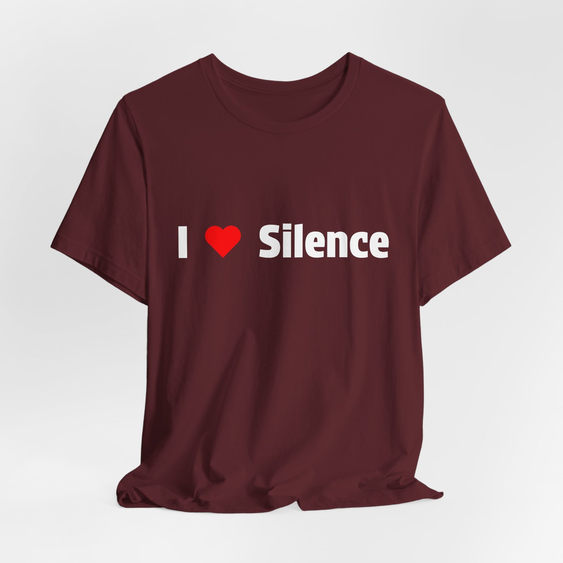 A maroon short-sleeve t-shirt with 'I Love Silence' printed in white across the chest.