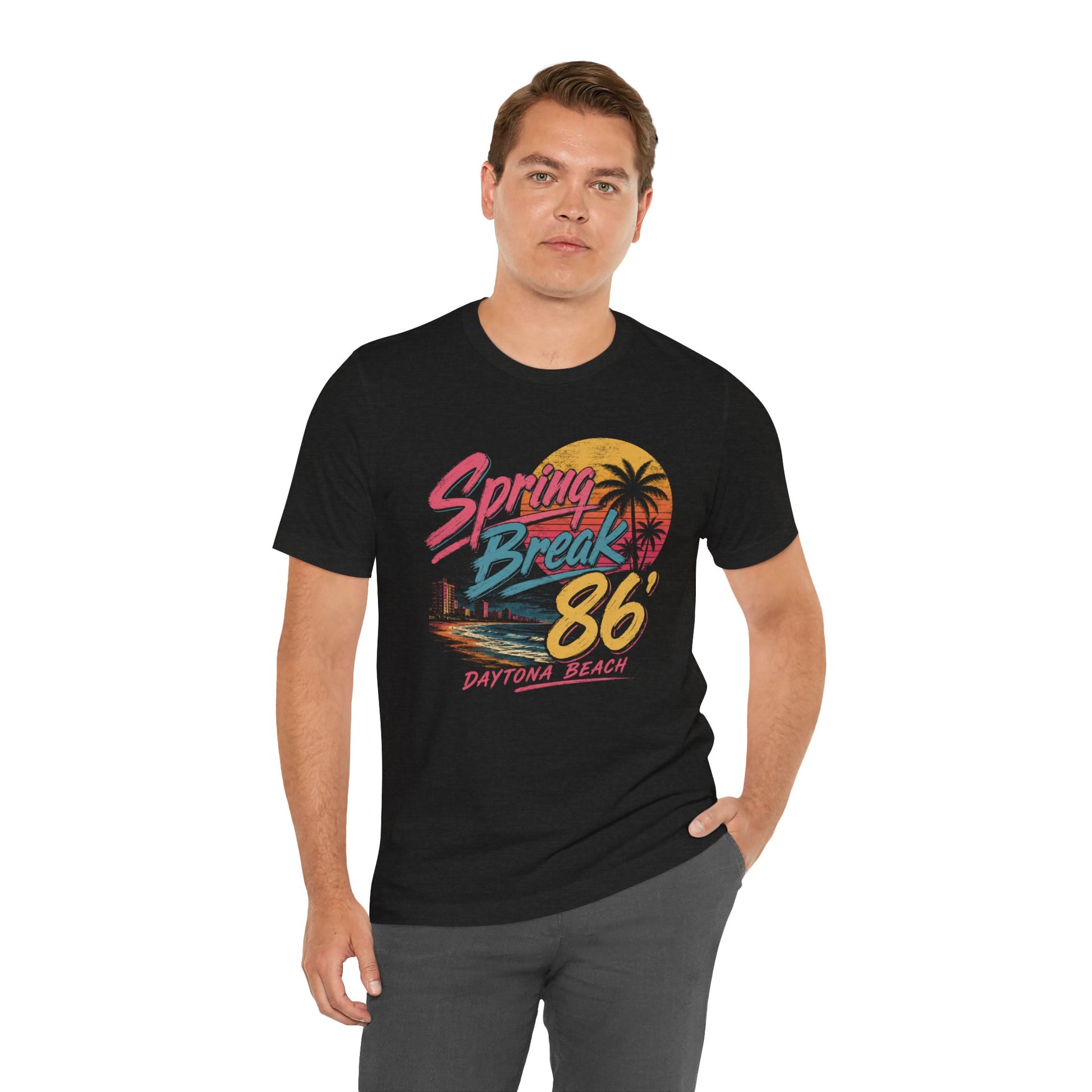 A man wearing a black short-sleeve graphic t-shirt with a colorful retro 'Spring Break 86 Daytona Beach' print.
