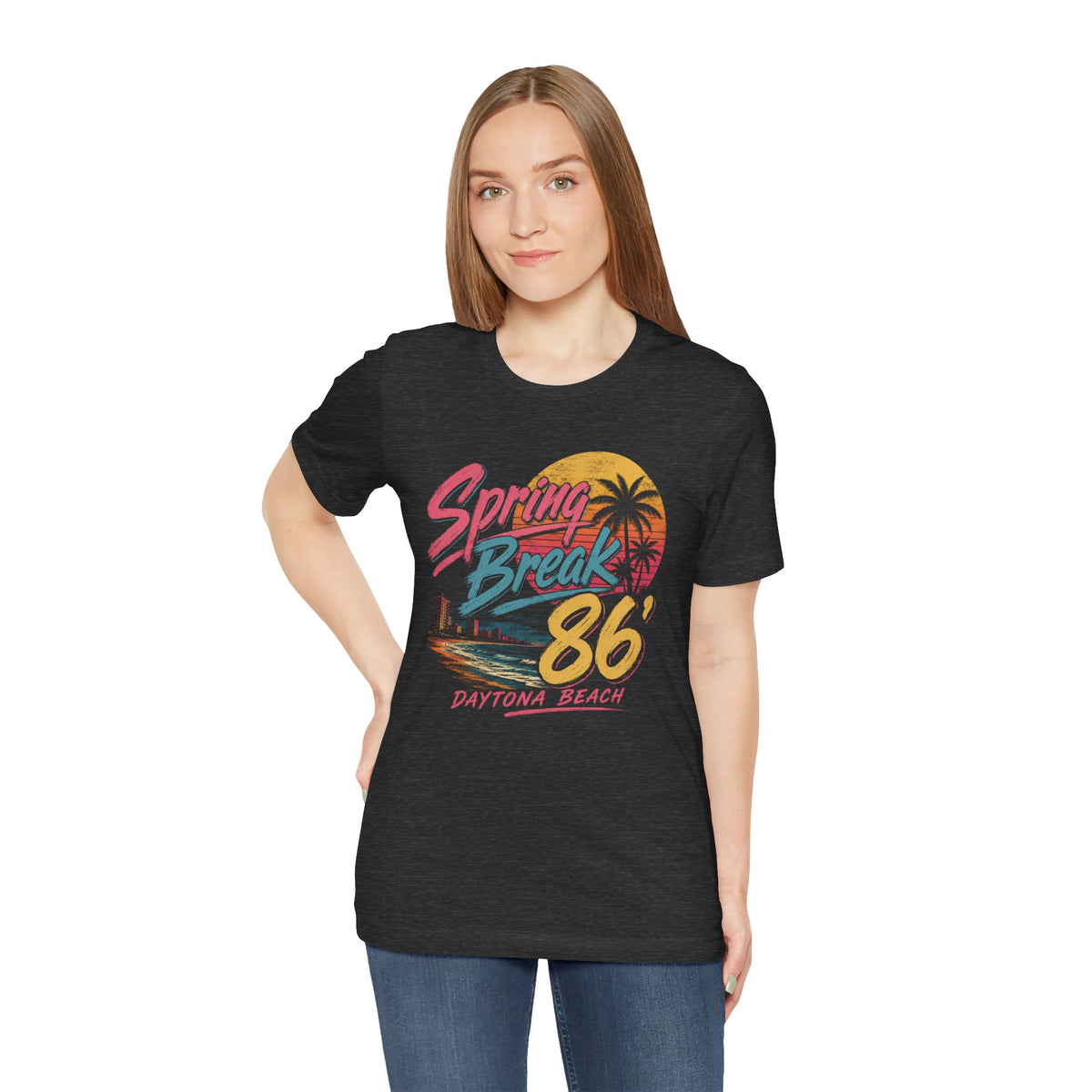 A crewneck t-shirt featuring a colorful retro graphic on the front that reads 'Spring Break 86 Daytona Beach' with a sunset and palm tree design.