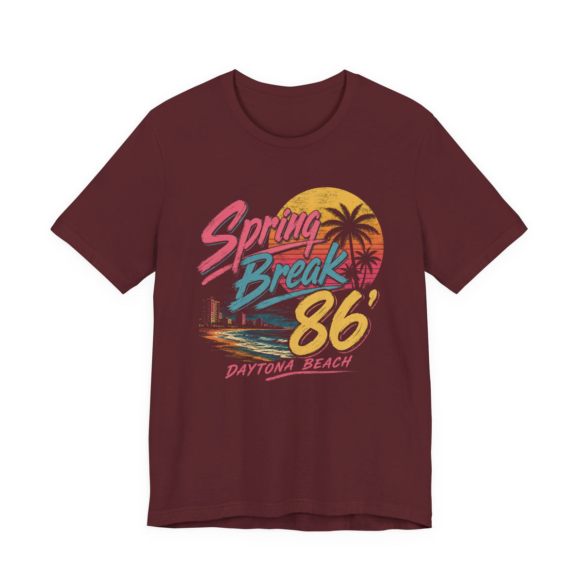A crewneck t-shirt featuring a colorful retro graphic on the front that reads 'Spring Break 86 Daytona Beach' with a sunset and palm tree design.