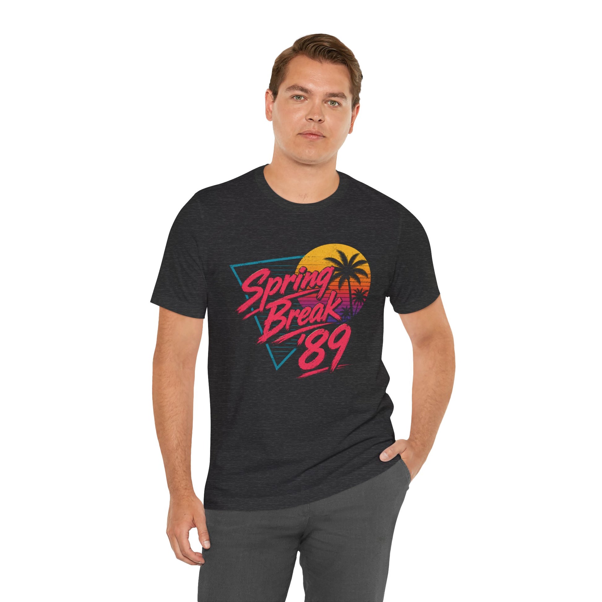 Person wearing a heather gray t-shirt with a graphic design reading 'Spring Break '89' on front. 