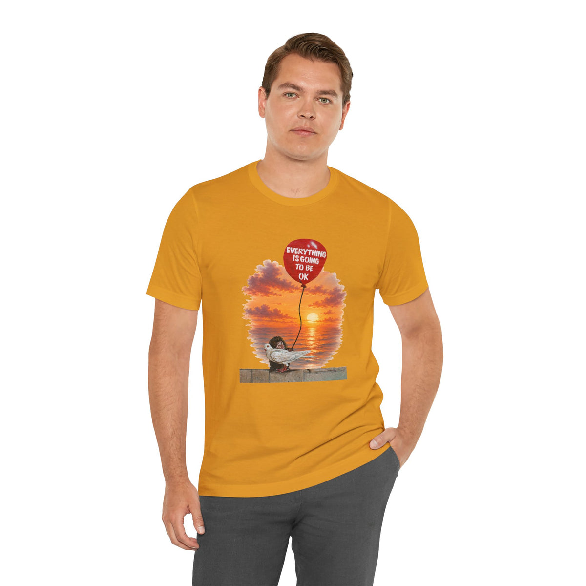 A short-sleeve t-shirt with a graphic print of a monkey hugging a dove while holding a red balloon that says 'EVERYTHING IS GOING TO BE OK'.
