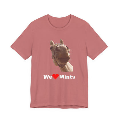 A heather pink short-sleeve t-shirt featuring a graphic of a horse's face above the text 'We Love Mints'.