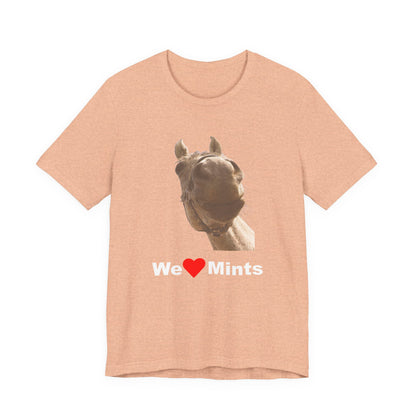 Peach short-sleeve t-shirt featuring a graphic of a horse's face above the text 'We Love Mints'.