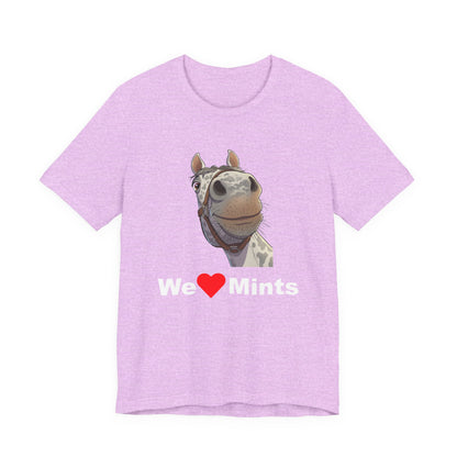 A pink short-sleeve t-shirt featuring a graphic of a horse's face above the text 'We Love Mints'.