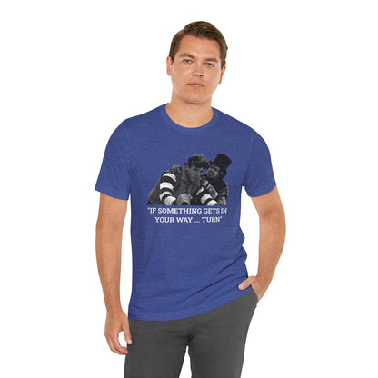 A heather blue short-sleeve t-shirt with a graphic from Better Off Dead.