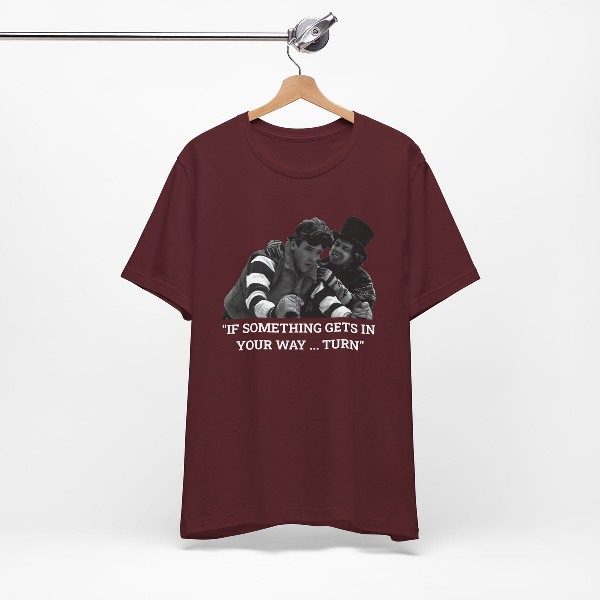 A maroon short-sleeve t-shirt with a graphic from Better Off Dead.