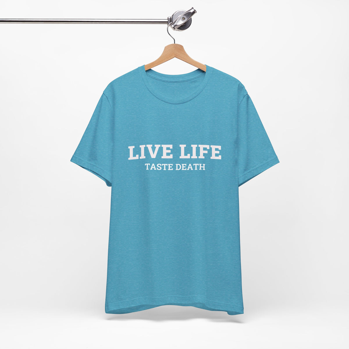 Aqua t-shirt with text quoted from 1990 Movie Ski Patrol, "Live Life Taste Death" in white.
