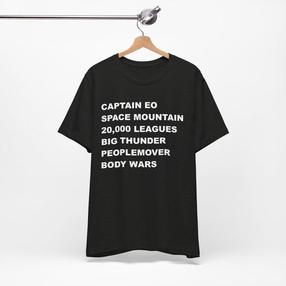 A black short-sleeve crewneck t-shirt with bold white text on the front listing old retro disney rides.