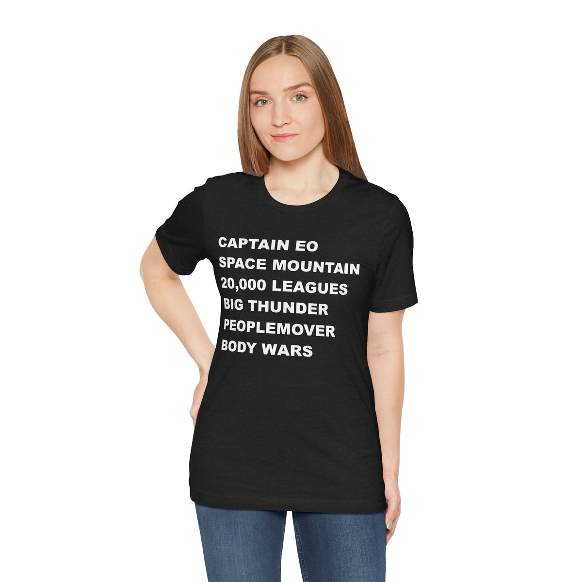 A black short-sleeve crewneck t-shirt with bold white text on the front listing old retro disney rides.