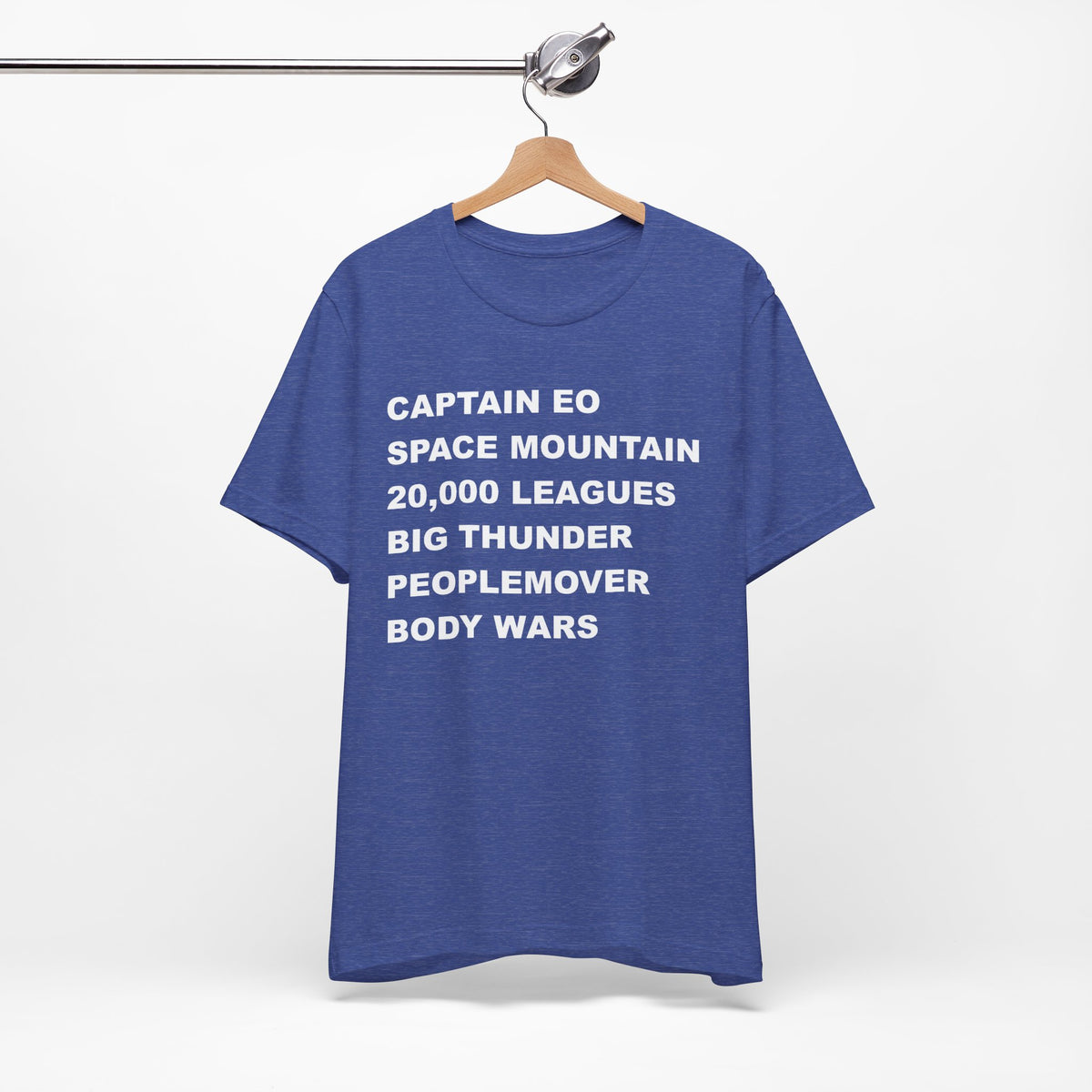 A heather blue short-sleeve crewneck t-shirt with bold white text on the front listing old retro disney rides.