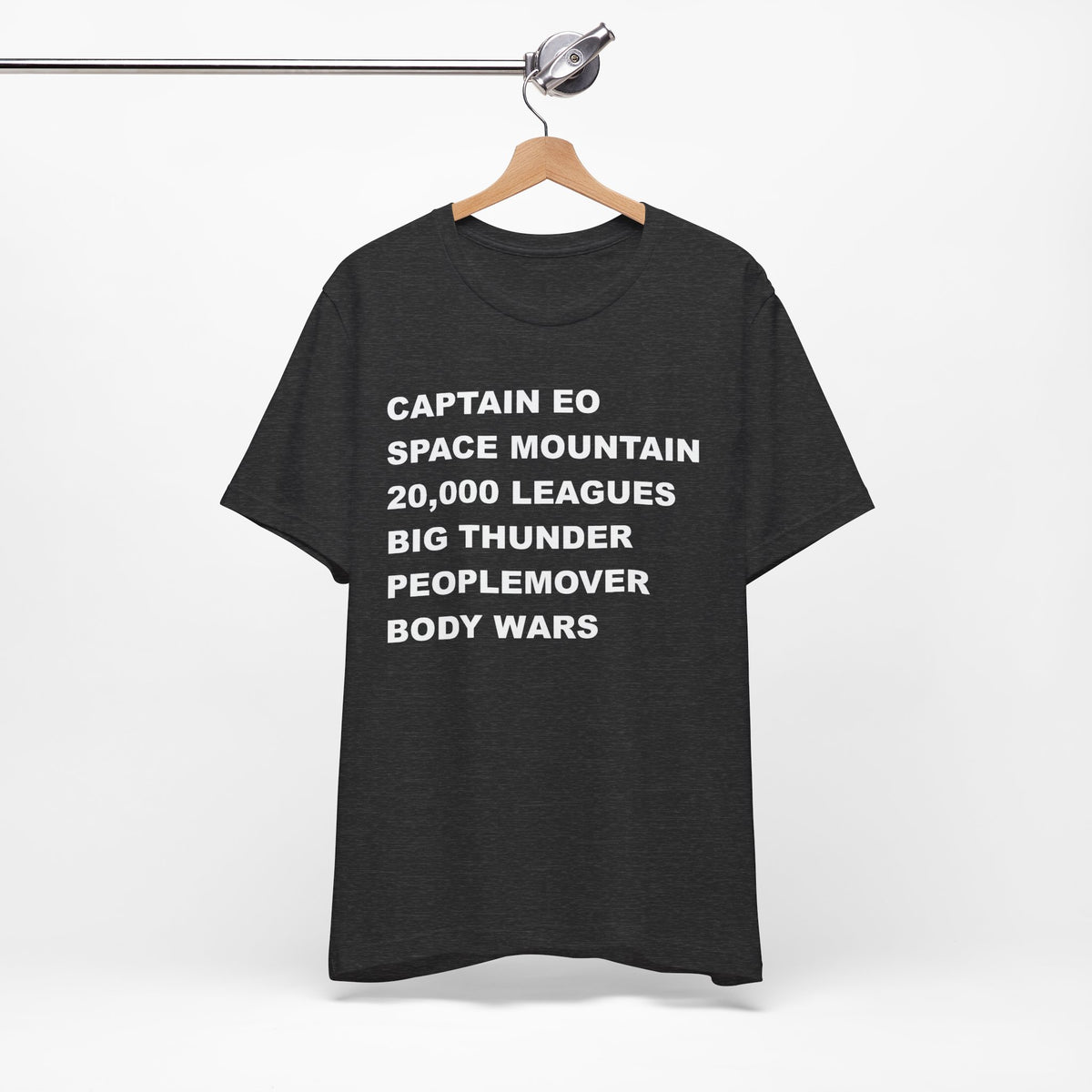 A heather gray short-sleeve crewneck t-shirt with bold white text on the front listing old retro disney rides.
