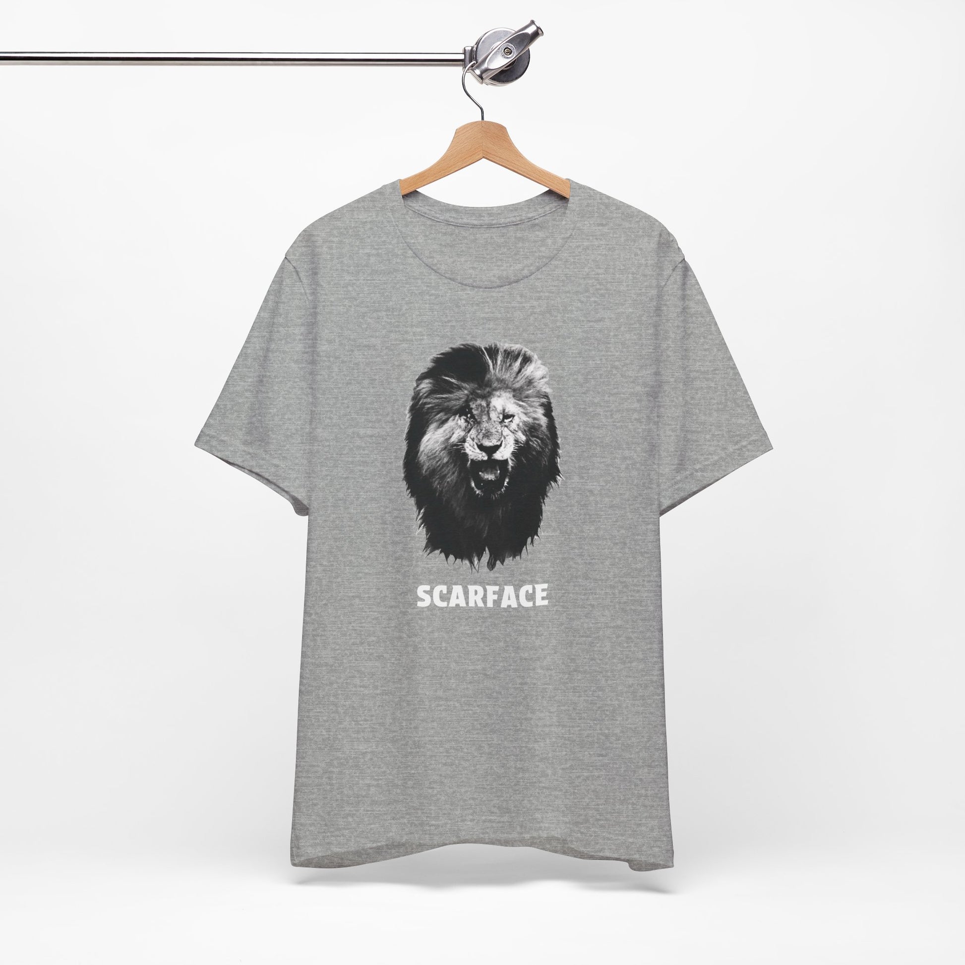 A gray short-sleeve t-shirt featuring a graphic of a roaring lion's head with the word 'SCARFACE' printed in white below it.