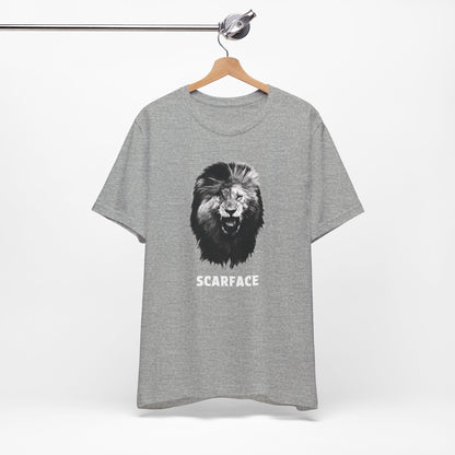 A gray short-sleeve t-shirt featuring a graphic of a roaring lion's head with the word 'SCARFACE' printed in white below it.