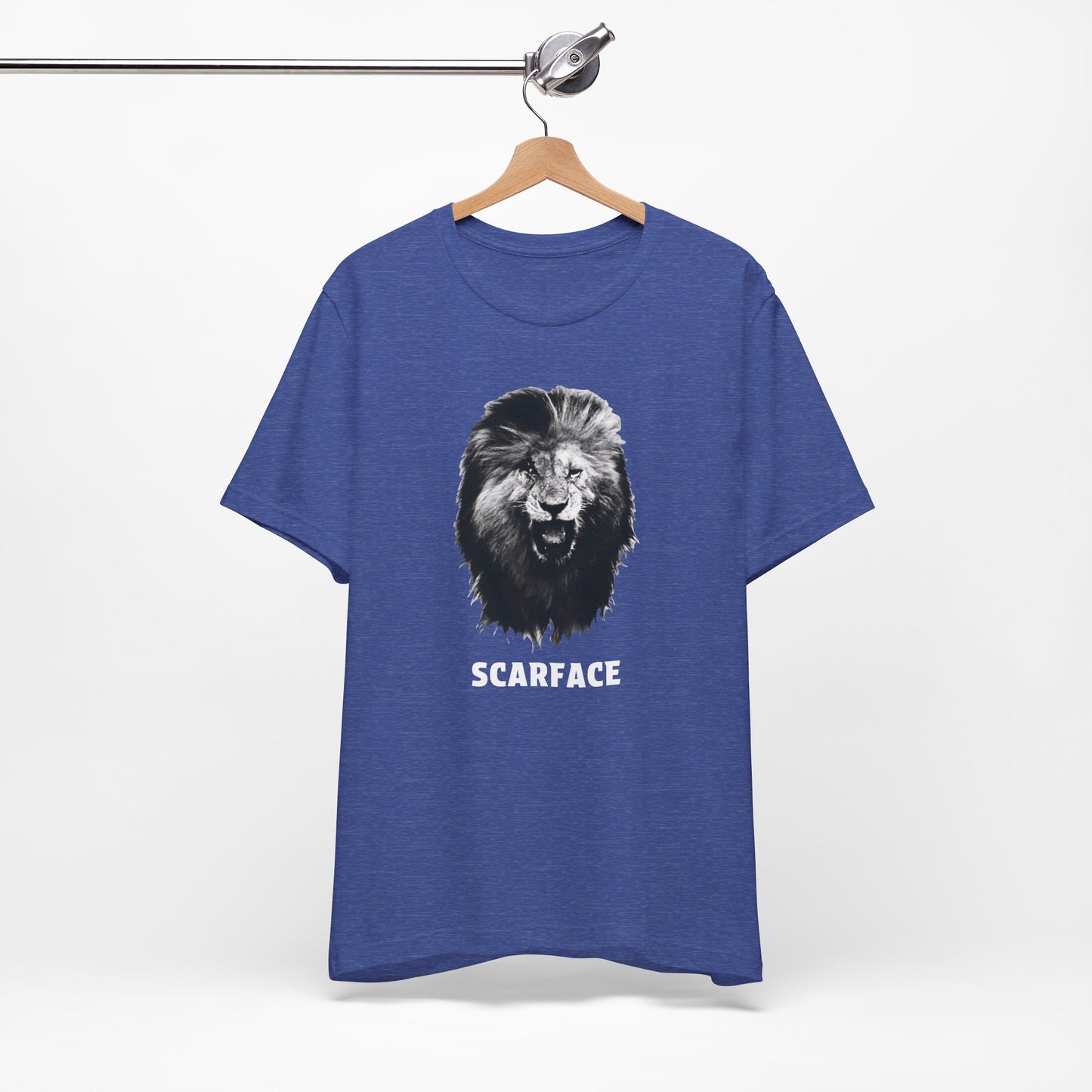 A heather blue short-sleeve t-shirt featuring a graphic of a roaring lion's head with the word 'SCARFACE' printed in white below it.