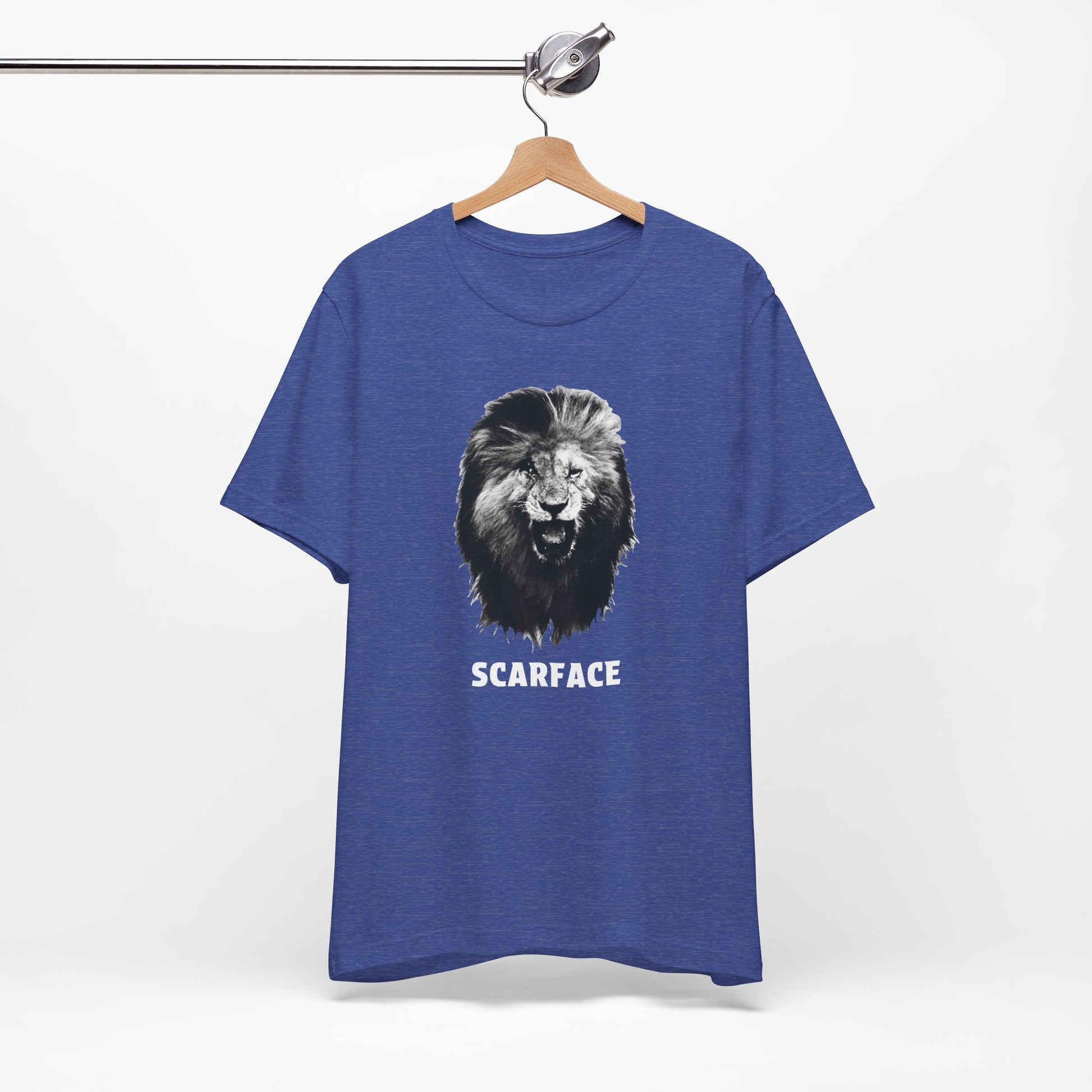 A heather blue short-sleeve t-shirt featuring a graphic of a roaring lion's head with the word 'SCARFACE' printed in white below it.