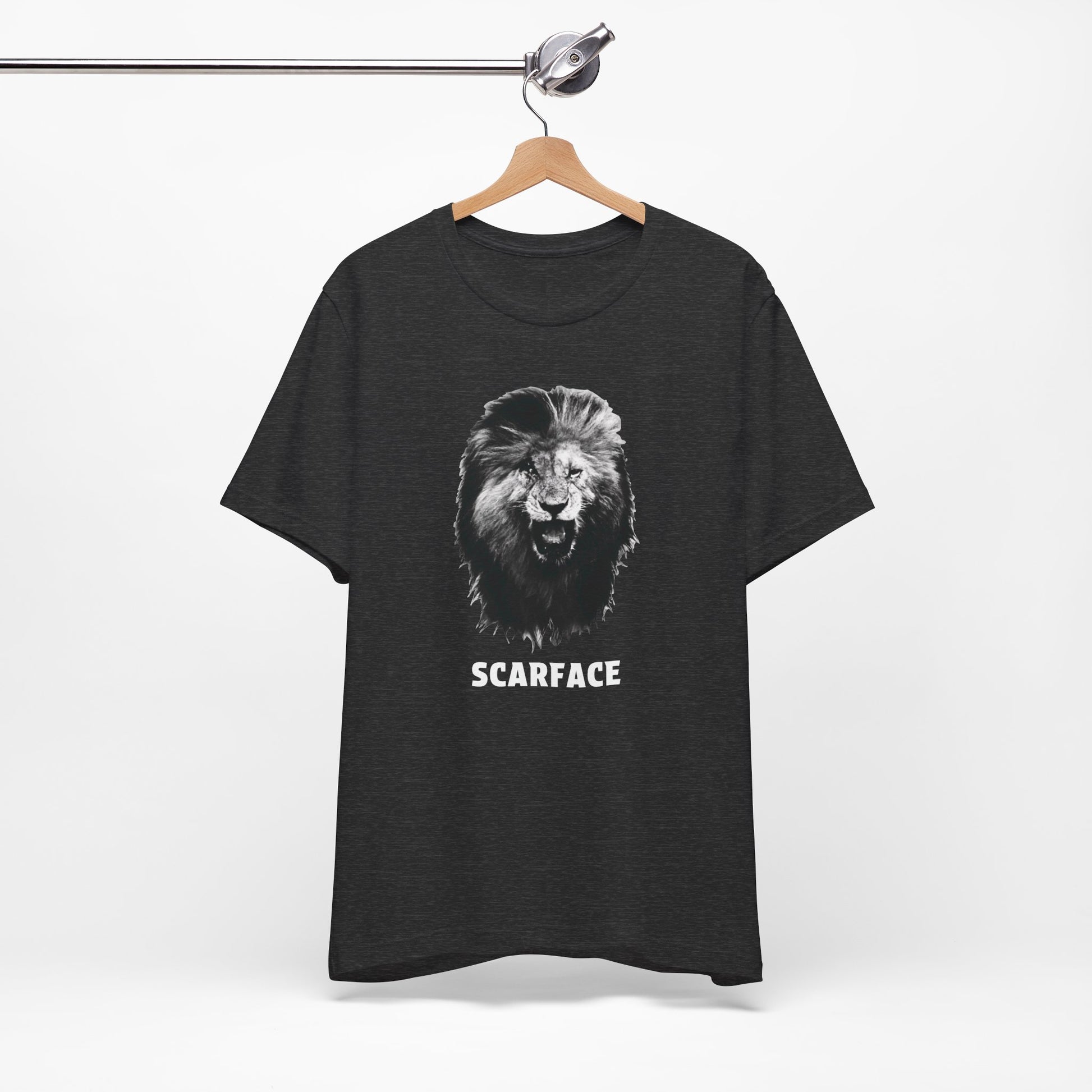 A heather black short-sleeve t-shirt featuring a graphic of a roaring lion's head with the word 'SCARFACE' printed in white below it.