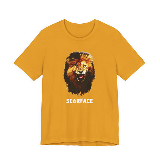 A mustard yellow short-sleeve t-shirt featuring a graphic of a roaring lion's head with the word 'SCARFACE' printed in white below it.