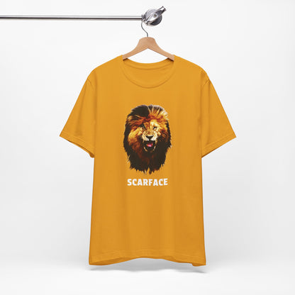 A mustard short-sleeve t-shirt featuring a graphic of a roaring lion's head with the word 'SCARFACE' printed in white below it.