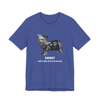 A heathered blue short-sleeve t-shirt with a graphic of a small dog wearing a black military-style jacket, with the text 'SMOKY' and 'WWII's Most Decorated War Dog' printed below.