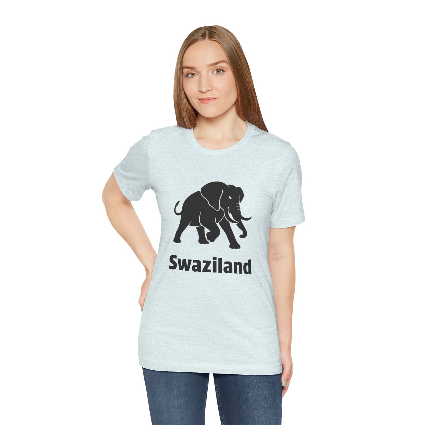 A woman modeling a light heather gray t-shirt with a black graphic of an elephant and the text 'Swaziland' printed on the front.