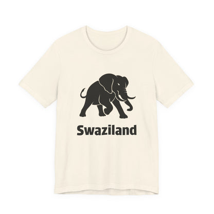 A heather natural short-sleeve t-shirt featuring a black graphic of a walking elephant with the word 'Swaziland' printed underneath.