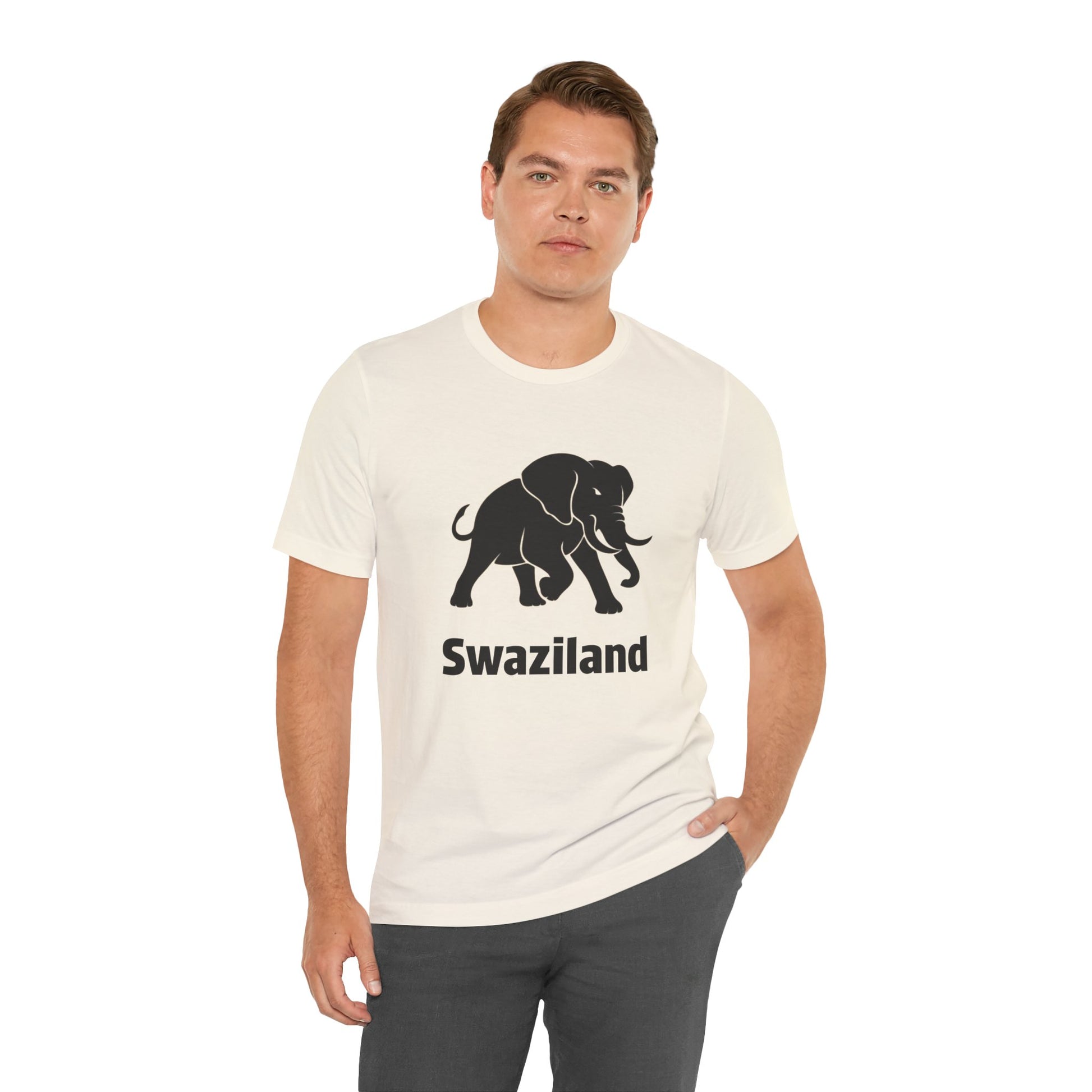 A man wearing a cream-colored t-shirt with a black elephant graphic and the word 'Swaziland' printed below it.