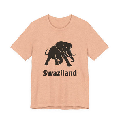 A heather peach colored short-sleeve t-shirt with a black graphic of an elephant and the word 'Swaziland' printed on the front.