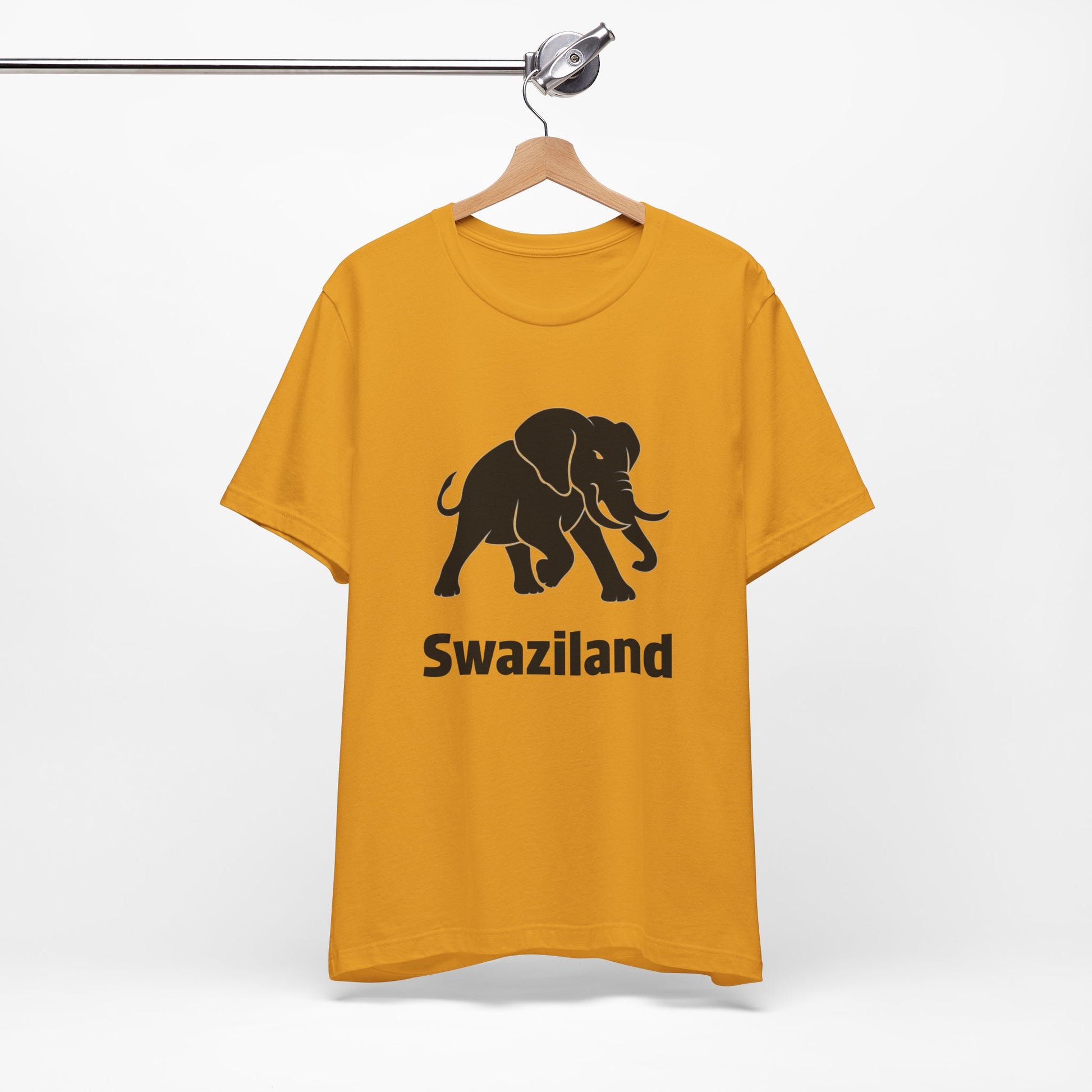 A mustard yellow t-shirt featuring a black elephant graphic and the word 'Swaziland' printed on the front.