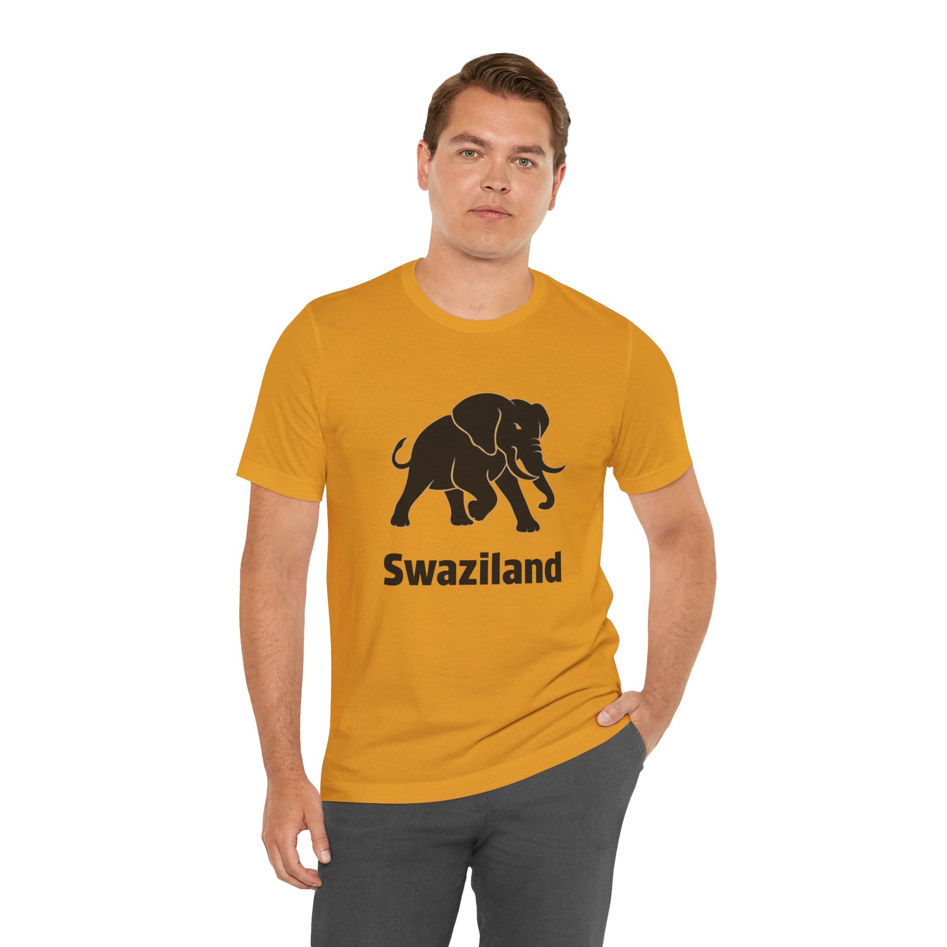 A man wearing a mustard yellow t-shirt with a black elephant graphic and the text 'Swaziland' printed on the front.