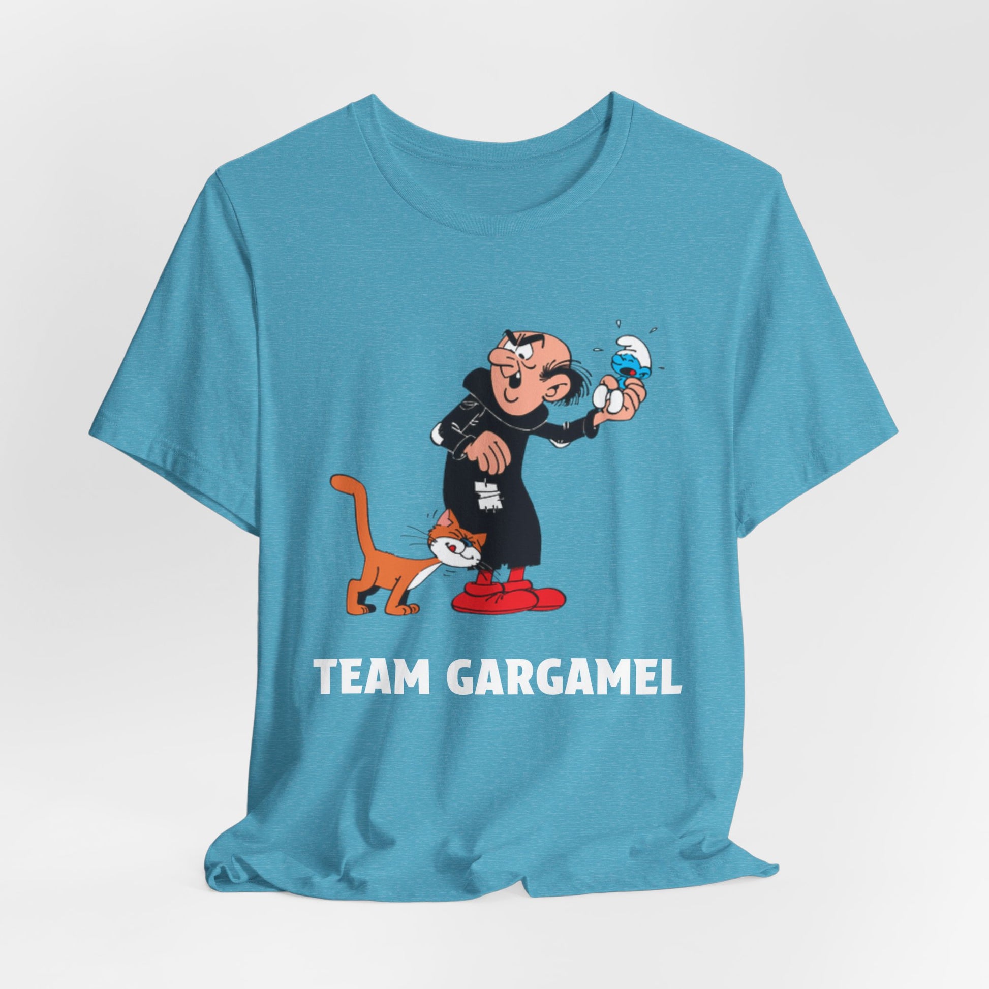 A light blue short-sleeve t-shirt with a cartoon graphic, with the text 'TEAM GARGAMEL' printed in white below.