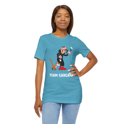 A woman modeling a heathered aqua short-sleeve t-shirt with a cartoon graphic and the text 'TEAM GARGAMEL' in white.