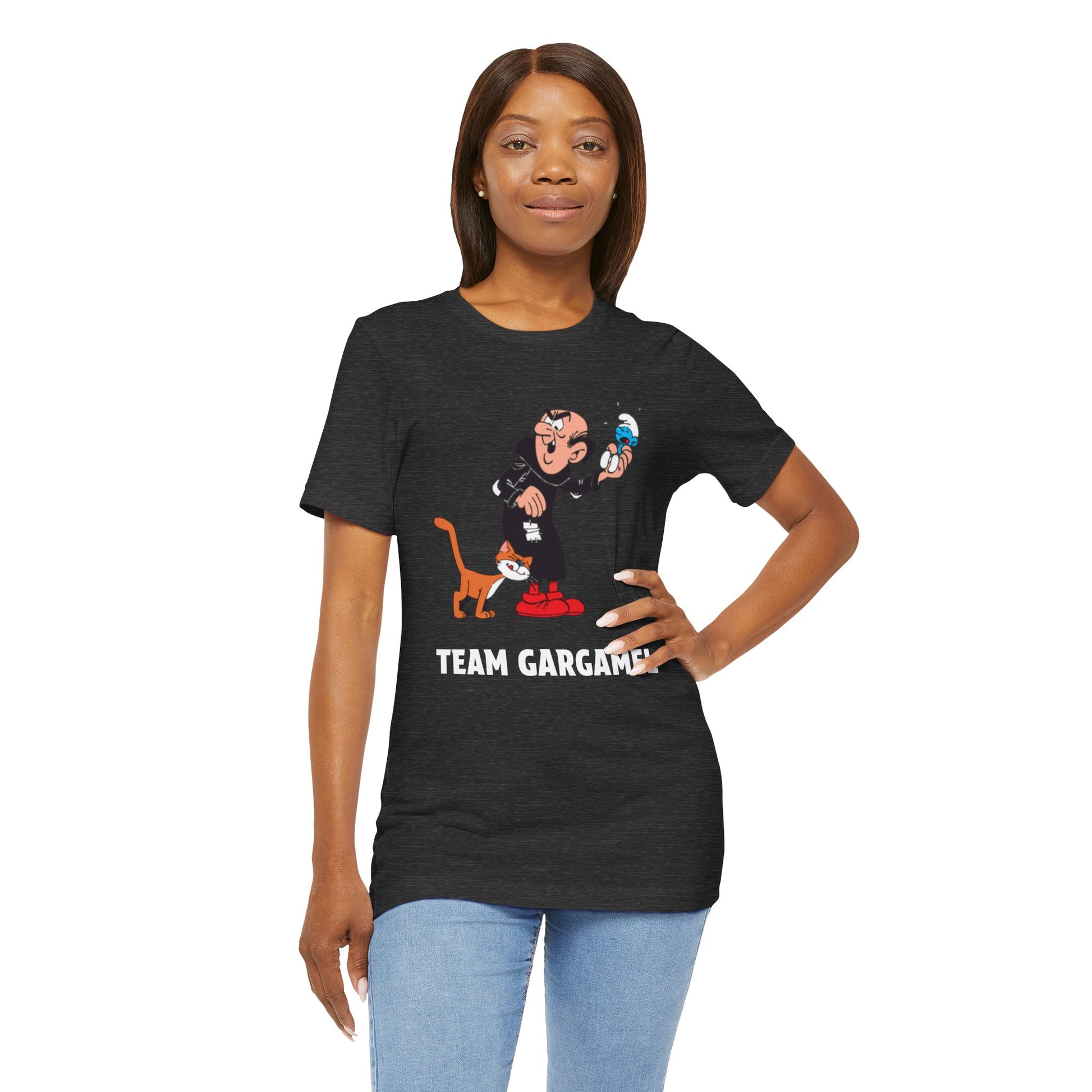 A woman modeling a dark heather gray graphic t-shirt with a cartoon with the text 'TEAM GARGAMEL' printed below. 