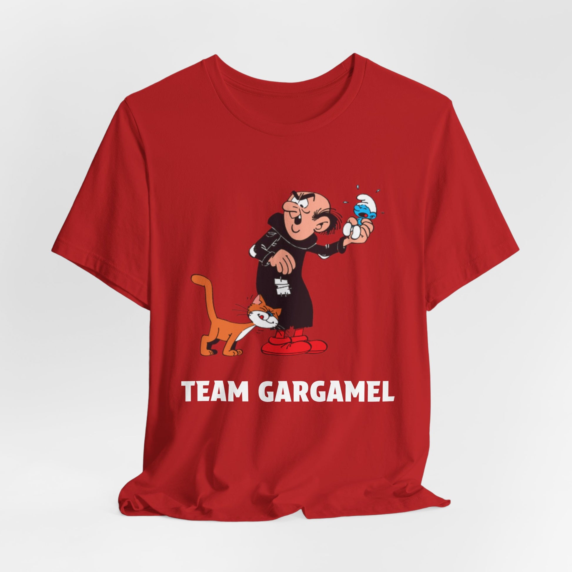 A red short-sleeve crewneck t-shirt featuring a cartoon graphic with the text 'TEAM GARGAMEL' printed in white.