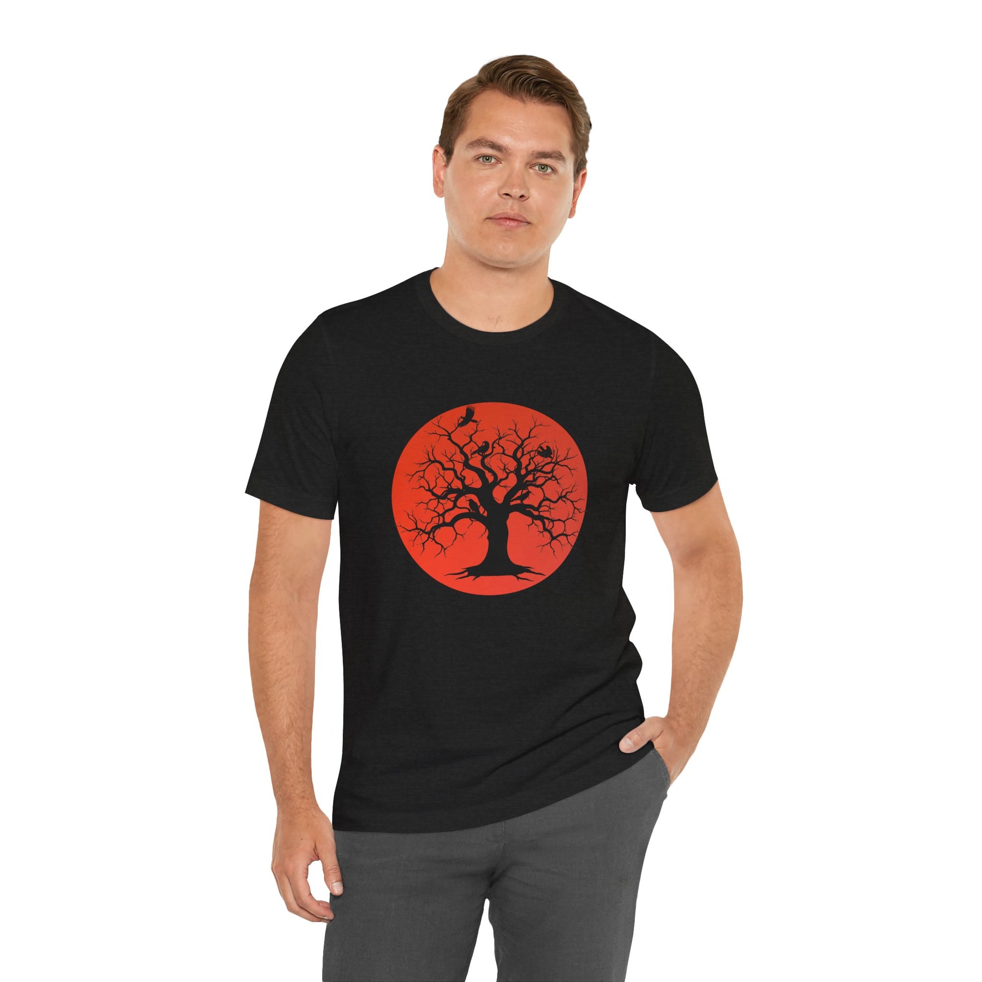 A black short-sleeve crewneck t-shirt featuring a graphic print of a black tree silhouette against a large blood moon with perched ravens.