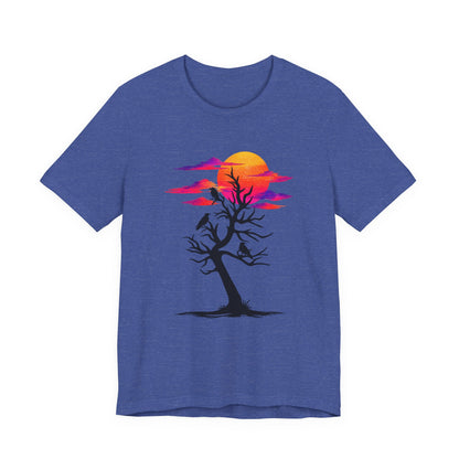 Tree of Ravens graphic tee featuring a black leafless tree with three ravens against a vibrant retro purple and orange sunset.