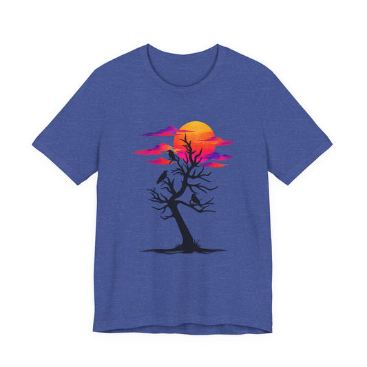 Tree of Ravens graphic tee featuring a black leafless tree with three ravens against a vibrant retro purple and orange sunset.