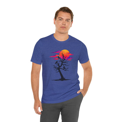 Tree of Ravens graphic tee featuring a black leafless tree with three ravens against a vibrant retro purple and orange sunset.