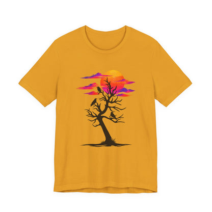 Tree of Ravens graphic tee featuring a black leafless tree with three ravens against a vibrant retro purple and orange sunset.