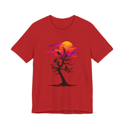 Tree of Ravens graphic tee featuring a black leafless tree with three ravens against a vibrant retro purple and orange sunset.